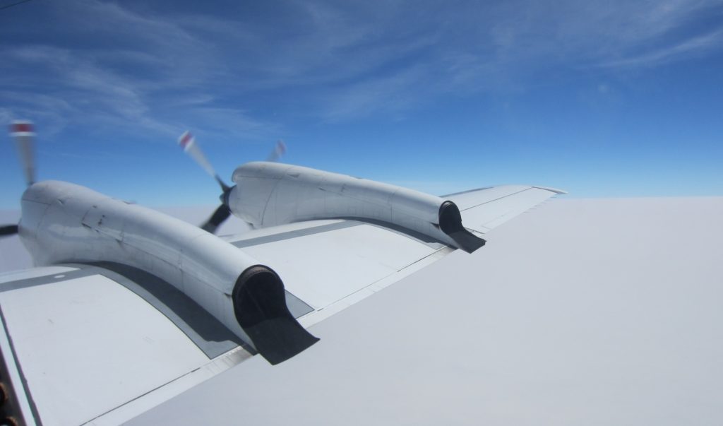 P-3 flying above stratocumulus clouds and under wispy cirrus clouds above. Credit: NASA/David Noone