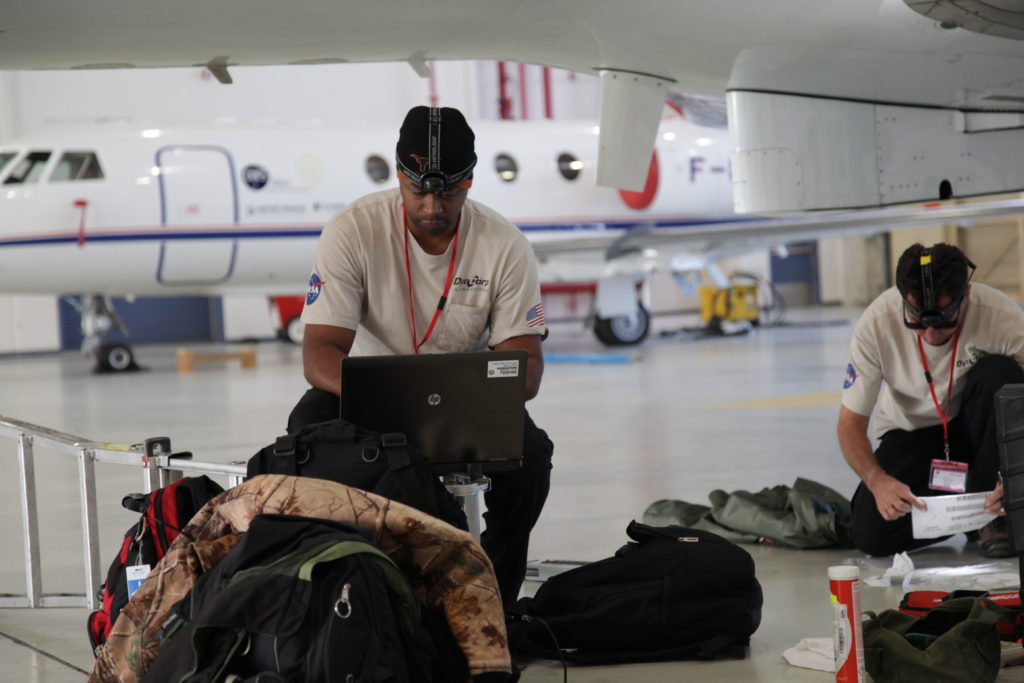 Johnny Davis (left) and Dave Fuller take inventory on arrival in Iceland. Credit: NASA