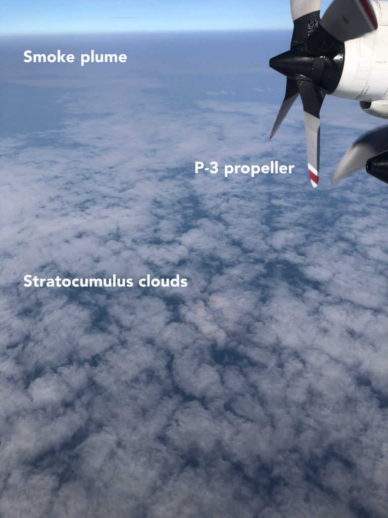 Image 2: View of smoke produced by fires in southern Africa over low-lying clouds in the southeast Atlantic Ocean from onboard the P-3 during the October 10th, 2018, ORACLES flight. Photo credit: Michael Diamond