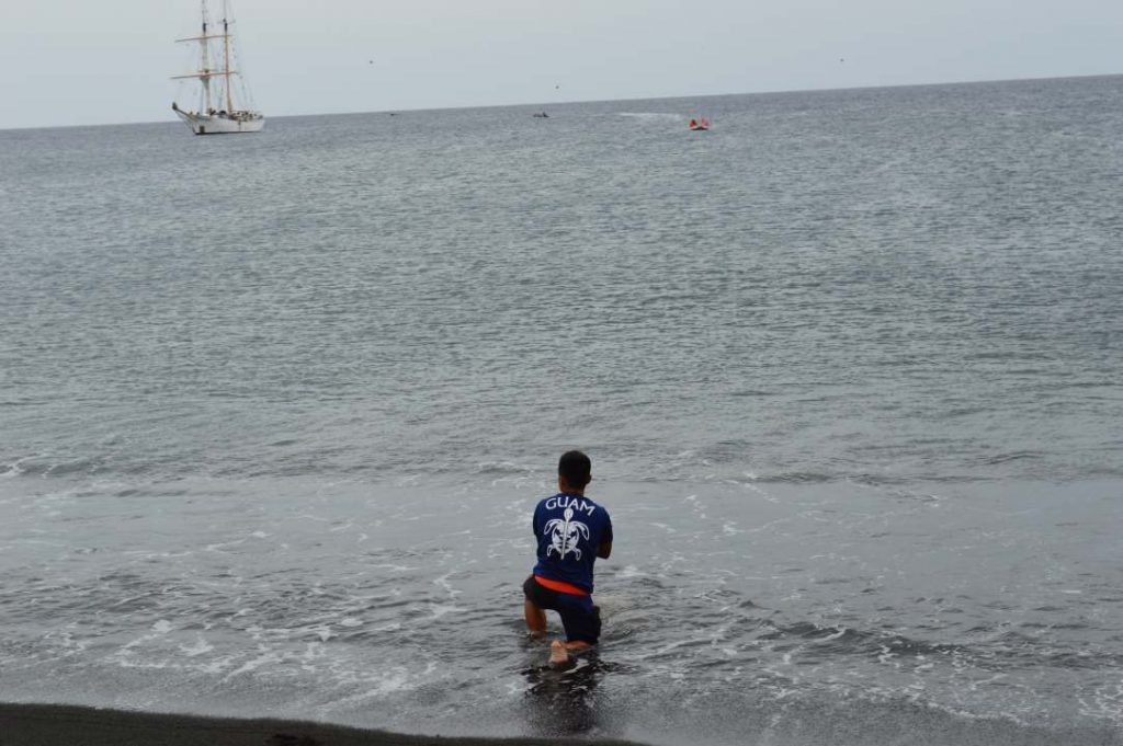 ank Wenninger paying Respect to Hunga Tonga Hunga Ha'apai, small boats and SSV Robert C. Seamans in the background