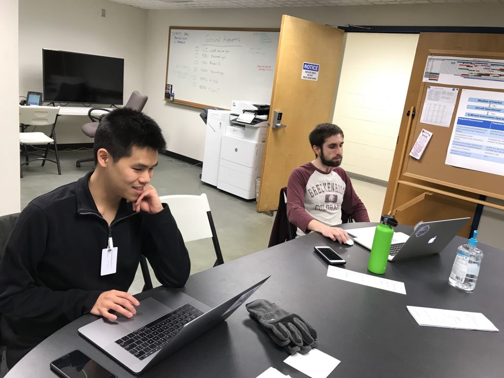 Phillip Yeh and Joe Finlon look at forecasts in the IMPACTS Mission Operations Center, at Wallops Flight Facility, Jan 23.