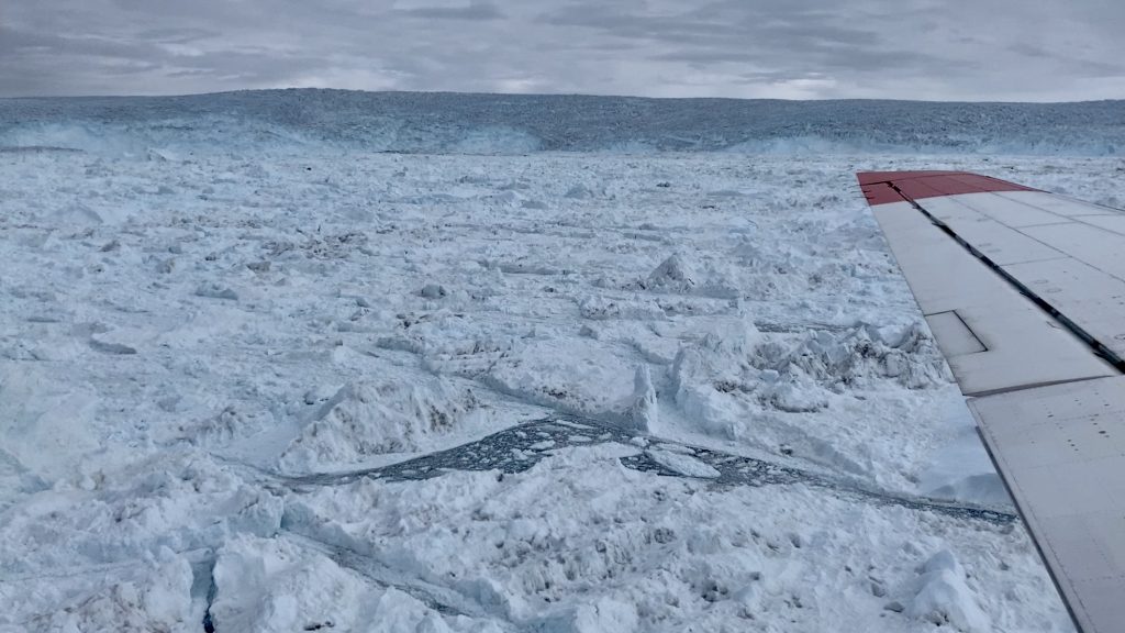 The view of Greenland’s Jakobshavn glacier from the DC-3 plane which carries the Oceans Melting Greenland Project scientists Credit: Josh Willis/JPL