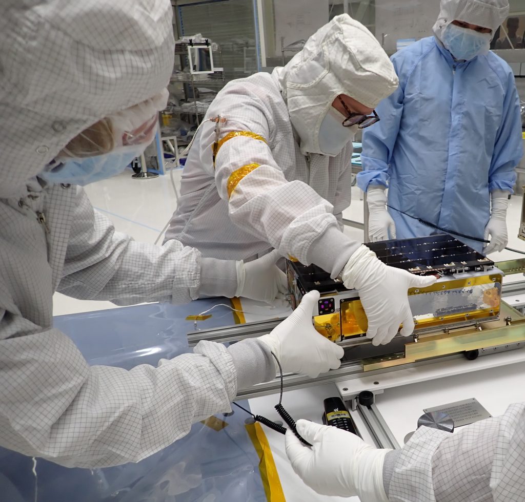 University of Colorado graduate student Arika Egan leads installation of the CUTE CubeSat into the EFS dispenser system at Vandenberg Space Force Base on July 23, 2021. Credit: NASA / WFF