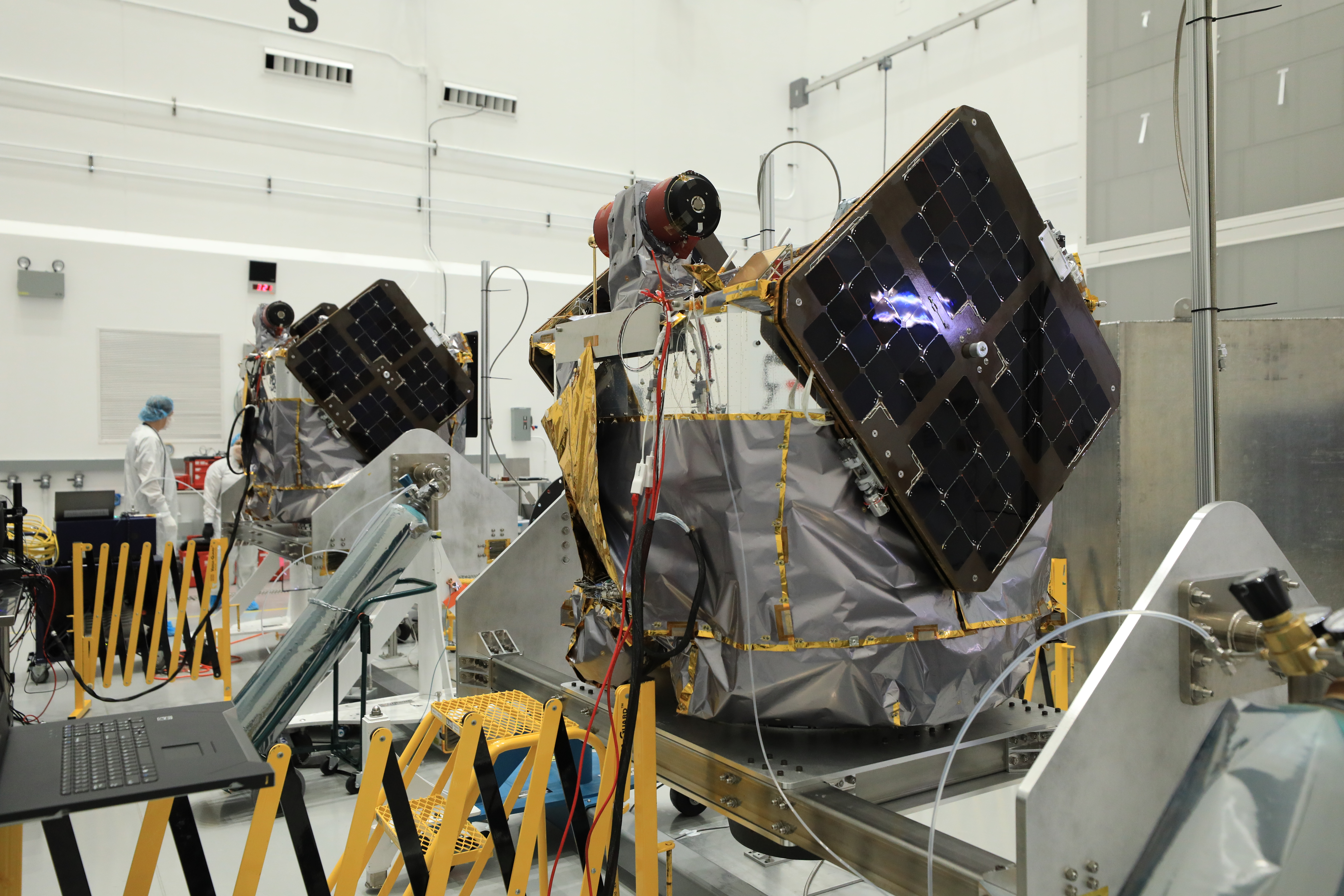 NASA’s Escape and Plasma Acceleration and Dynamics Explorers (ESCAPADE) identical dual spacecrafts are inspected and processed on spacecraft dollies in a high bay of the Astrotech Space Operations Facility near the agency’s Kennedy Space Center in Florida on Thursday, Aug. 22, 2024. 