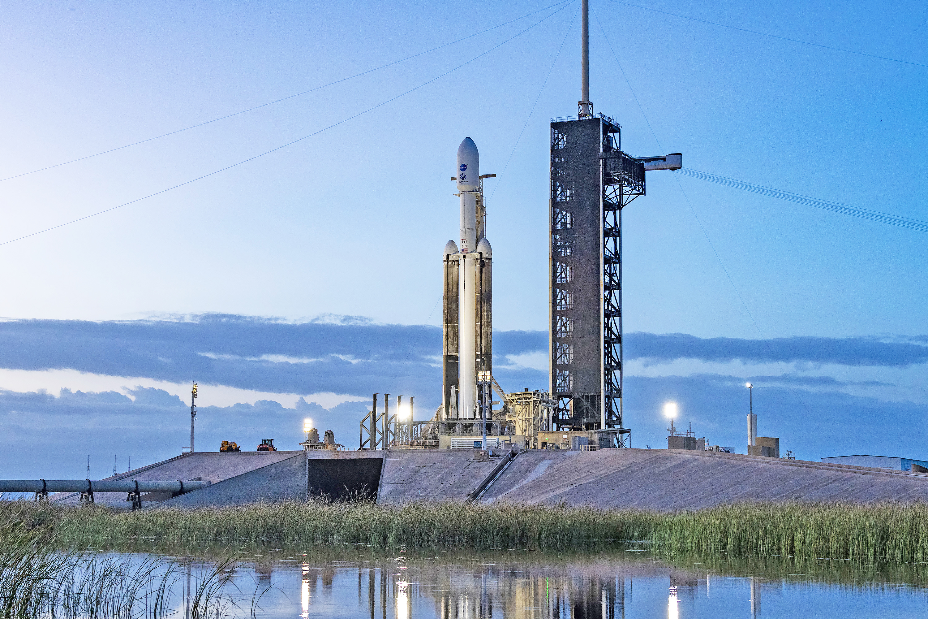 NASA’s Europa Clipper spacecraft and SpaceX’s Falcon Heavy rocket stands at Launch Pad 39A on Sunday, Oct. 13, 2024, at the agency’s Kennedy Space Center in Florida ahead of launch to Jupiter’s icy moon, Europa. The spacecraft will complete nearly 50 flybys of Europa to determine if there are conditions suitable for life beyond Earth. 