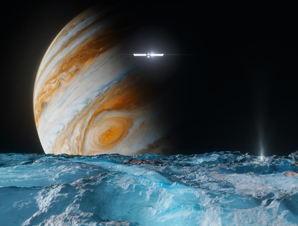 This artist's concept depicts NASA's Europa Clipper spacecraft as it orbits Jupiter and passes over the gas giant's ice-covered moon Europa. Scheduled to arrive at Jupiter in April 2030, the mission will be the first to specifically target Europa for detailed science investigation.