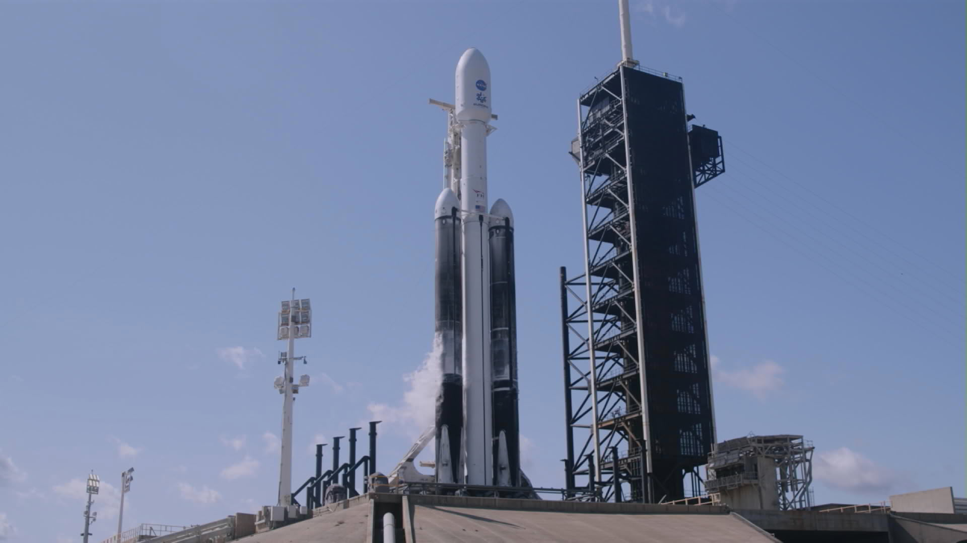 NASA’s Europa Clipper spacecraft and SpaceX’s Falcon Heavy rocket stands at Launch Pad 39A on Sunday, Oct. 13, 2024, at the agency’s Kennedy Space Center in Florida ahead of launch to Jupiter’s icy moon, Europa. 