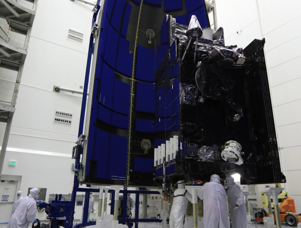 Team members with United Launch Alliance (ULA) prepare the Geostationary Operational Environmental Satellite (GOES-R) for encapsulation in the payload fairing inside the Astrotech payload processing facility in Titusville, Florida near NASA's Kennedy Space Center.