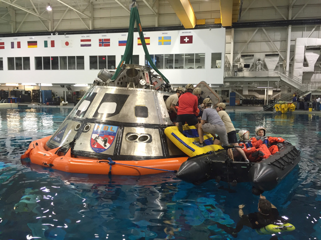 Team members from NASA's Orion and the Ground Systems Development and Operations (GSDO) Program practice egress training Oct. 6-8 using a mockup of the Orion crew module in the 6.2-million-gallon Neutral Buoyancy Laboratory at the agency's Johnson Space Center in Houston. Photo credit: NASA