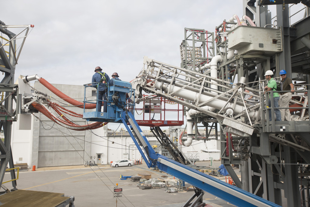 Engineers and technicians prepare the Orion Service Module Umbilical for a series of tests,, beginning Nov. 30, at the Launch Equipment Test Facility at NASA's Kennedy Space Center in Florida. Photo credit: NASA/Cory Huston