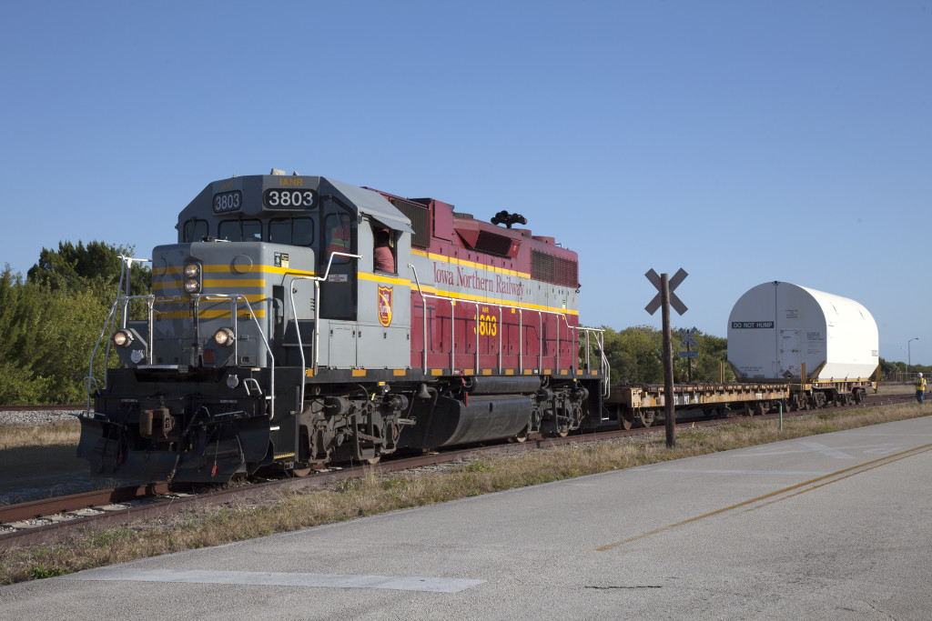 A train hauls two pathfinder solid rocket booster segments to Kennedy Space Center. 