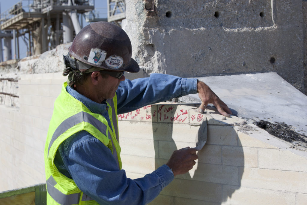 The final brick was installed on the north side of the flame trench at Launch Complex 39B.