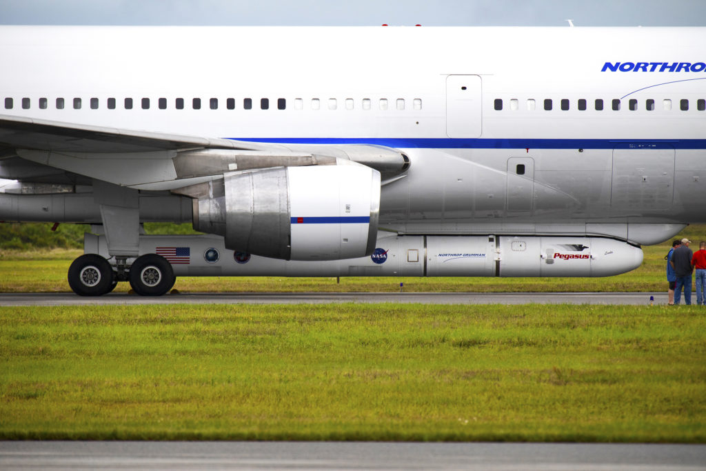 Northrop Grumman's L-1011 Stargazer aircraft is on the runway after touching down at the Cape Canaveral Air Force Station Skid Strip on Oct. 19, 2018. The company's Pegasus XL rocket, containing NASA's Ionospheric Connection Explorer, or ICON, satellite is attached beneath the aircraft. Photo credit: NASA/Kim Shiflett