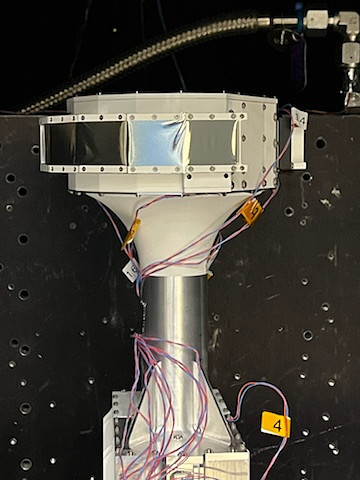 Front view of the HIT instrument. Shows four metallic silver sensor covers at the top of the instrument, with a white and solver body, with blue and red wires at the silver cylinder body.