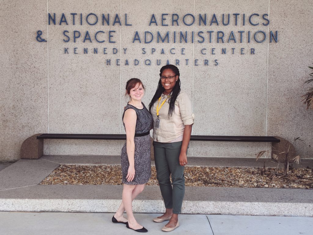 Sarah & Nicole in front of the KSC sign.