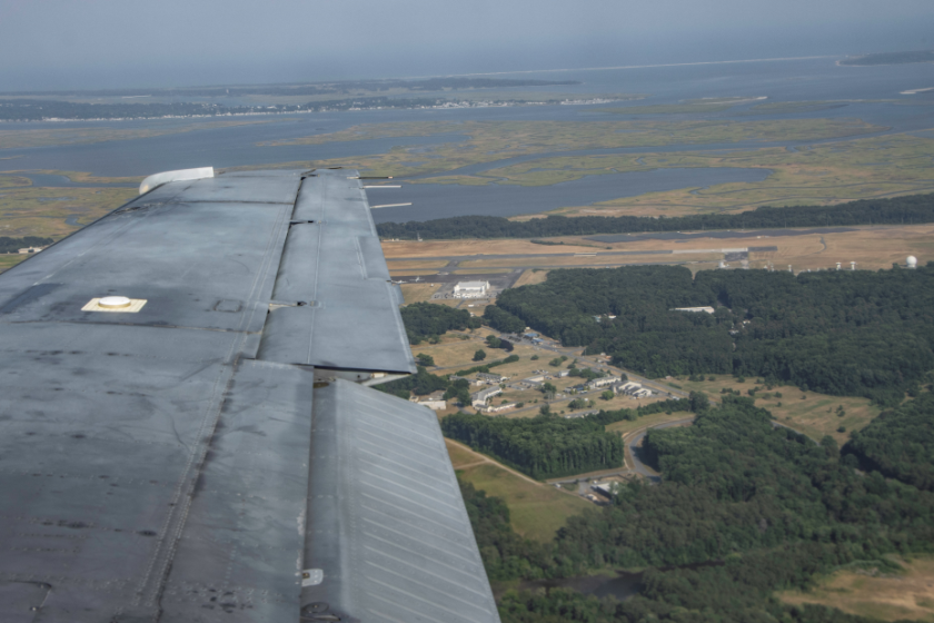 NASA's Wallops Flight Facility seen from a gray aircraft.