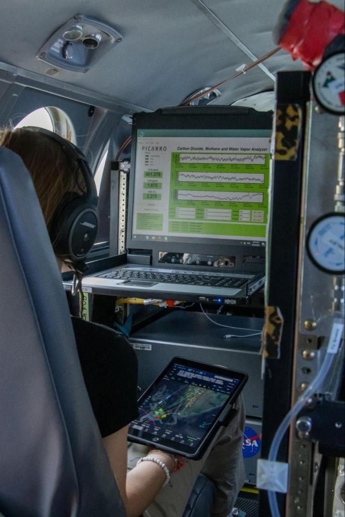 Graphs of data on a computer screen aboard an aircraft.