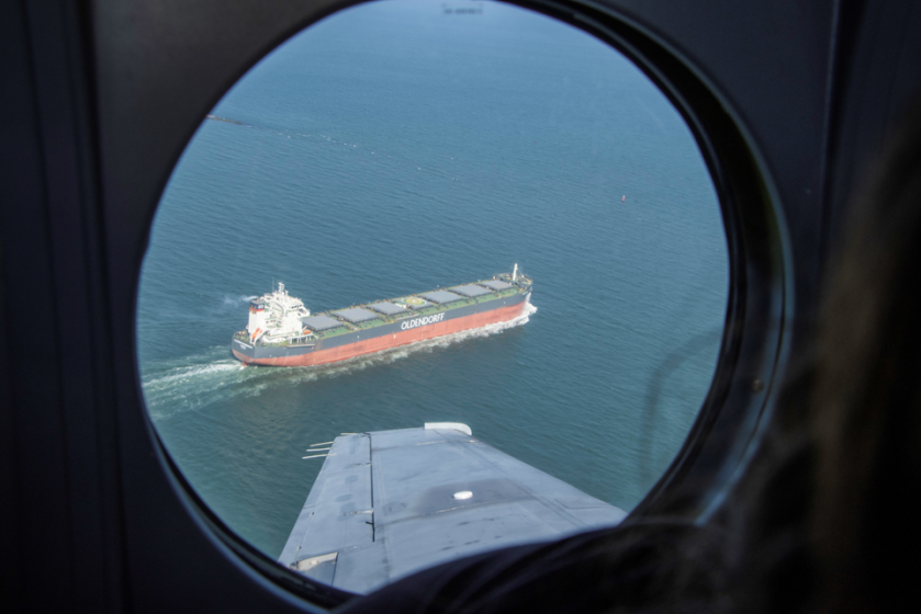 A large cargo ship is seen from above in the Chesapeake Bay. 