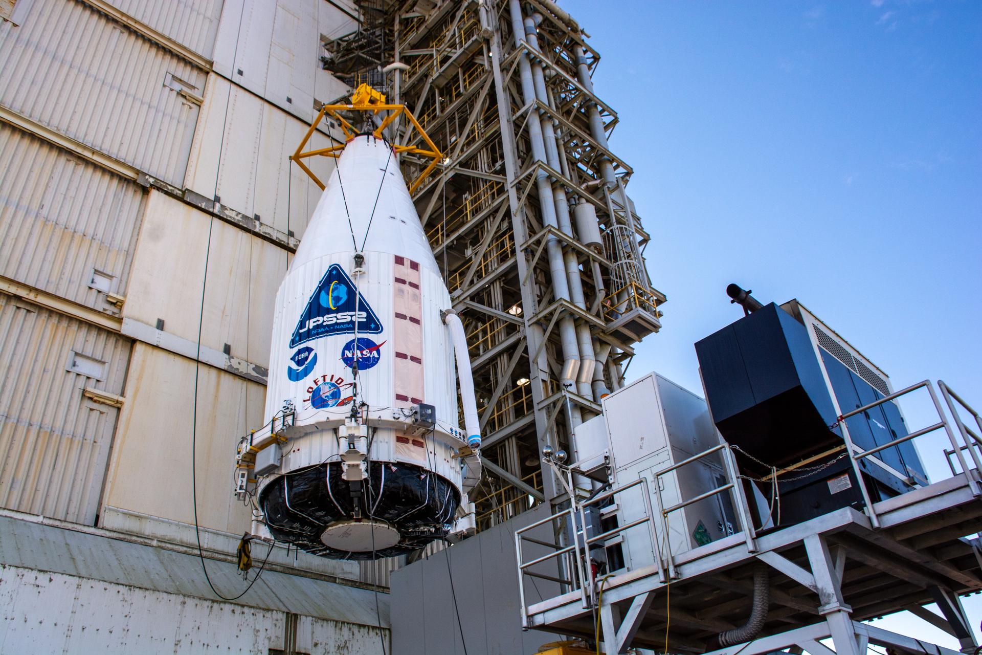 A close-up view of the United Launch Alliance Atlas V payload fairing containing the National Oceanic and Atmospheric Administration’s (NOAA) Joint Polar Satellite System-2 (JPSS-2) as it is hoisted up by crane at the vertical integration facility at Space Launch Complex 3 at Vandenberg Space Force Base (VSFB) in California on Oct. 18, 2022. 