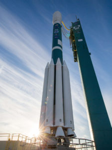 A ULA Delta II rocket carrying NOAA's JPSS-1 spacecraft stands poised for launch.