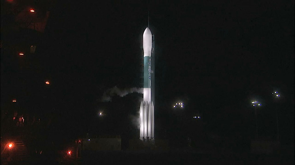 Gaseous oxygen vents away from the Delta II rocket as the vehicle awaits liftoff. 