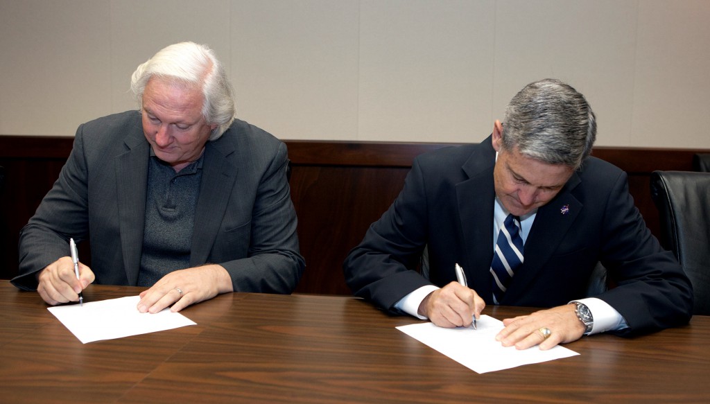 Kennedy Space Center Director Bob Cabana, right, signed a Space Act agreement with John Pederson, Board Chairman and CEO of Light Visually Transceiving (LVX) System Corp., to facilitate a collaboration in developing a potentially ground-breaking technology in electronic communications. Photo credit: NASA/ Kim Shiflett