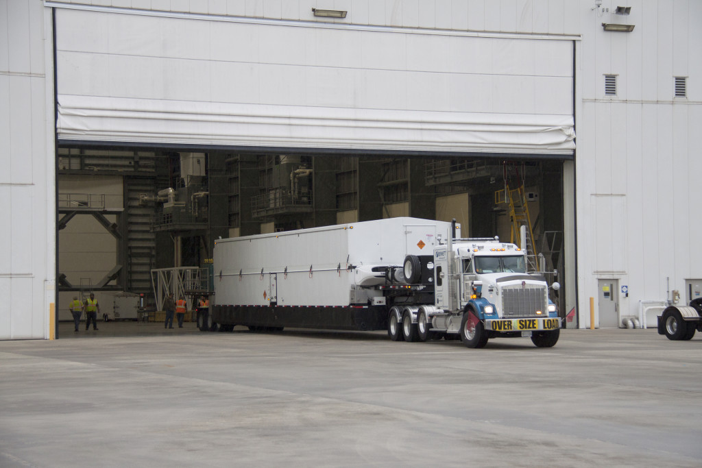 A truck delivers the United Launch Alliance Centaur upper stage to the Horizontal Integration Facility