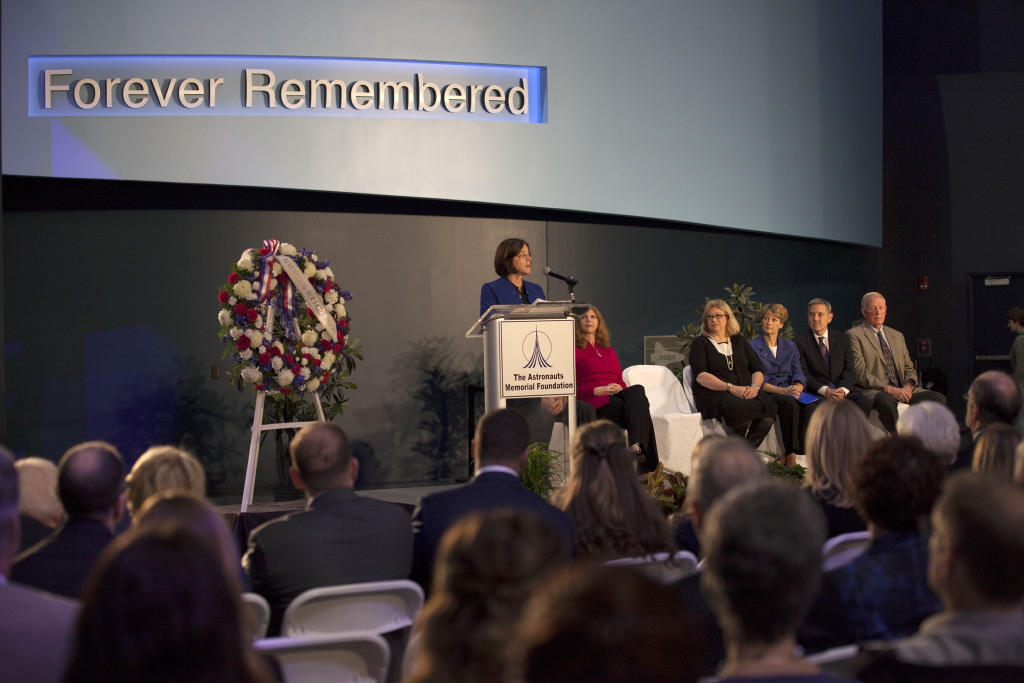 NASA astronaut Barbara Morgan speaks at Day of Remembrance ceremony as crew family members and officials look on