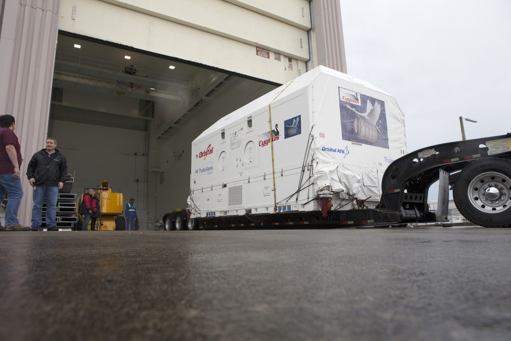 Orbital ATK CRS-6 Payload Cargo Module arrives by truck at Kennedy Space Center's Space Station Processing Facility