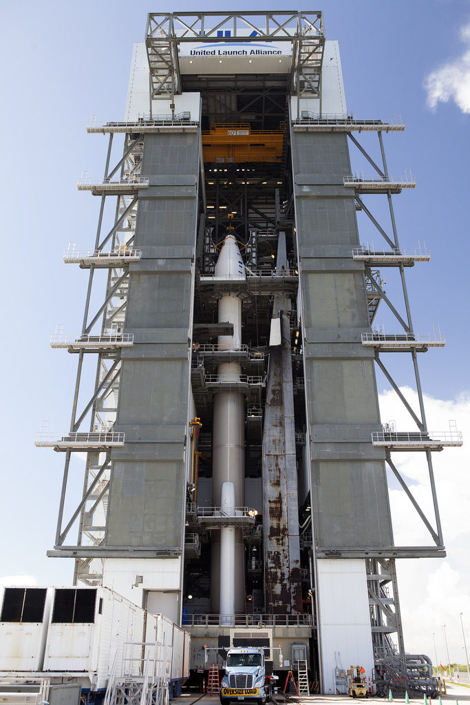 The OSIRIS-REx spacecraft, enclosed in a payload fairing, is positioned atop a United Launch Alliance Atlas V rocket at Space Launch Complex 41 at Cape Canaveral Air Force Station, Aug. 29, 2016