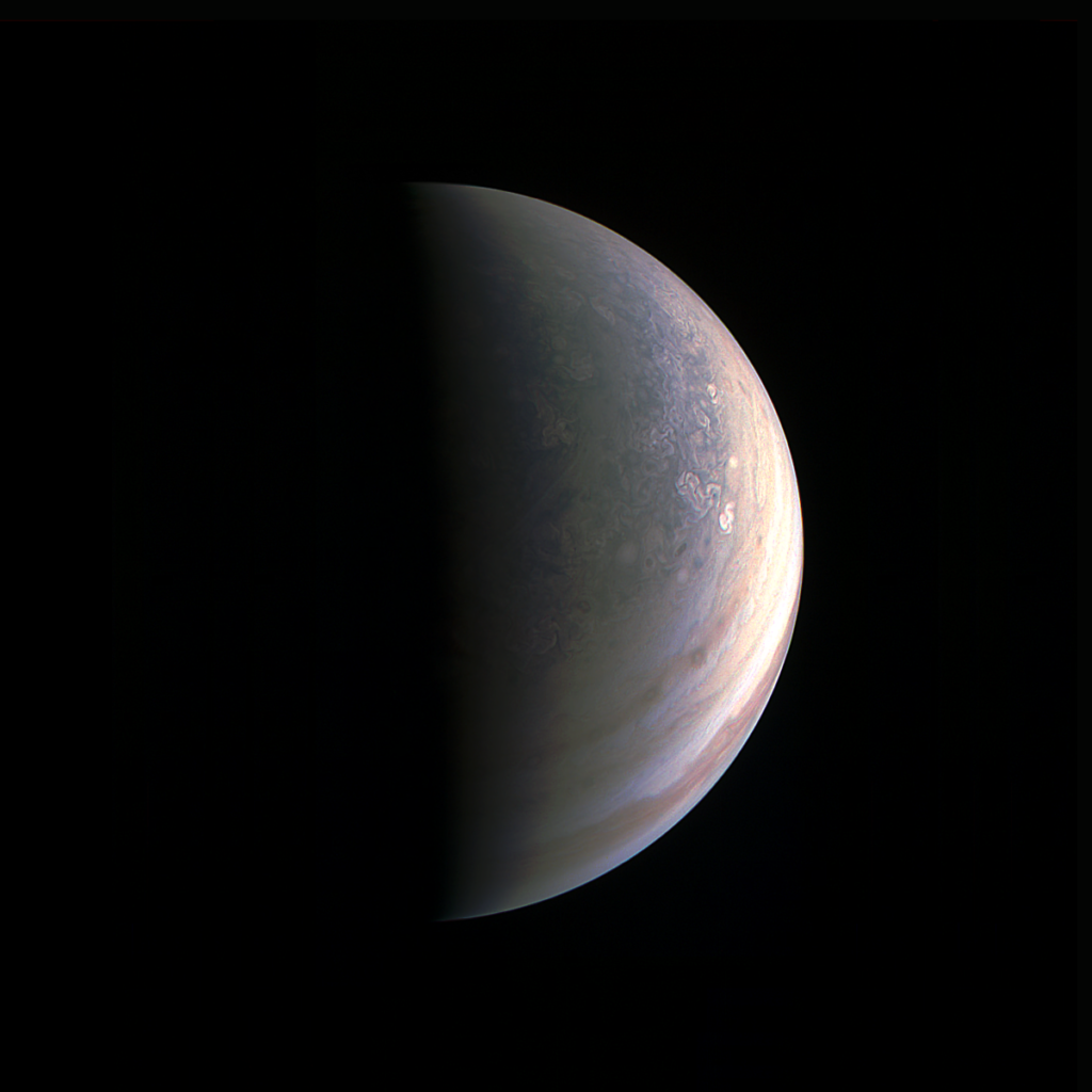 NASA's Juno spacecraft captured this view as it closed in on Jupiter's north pole, about two hours before closest approach on Aug. 27, 2016.