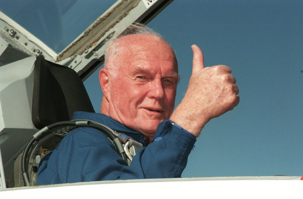 STS-95 Payload Specialist John H. Glenn Jr., senator from Ohio, gives a thumbs up on his arrival at Kennedy 