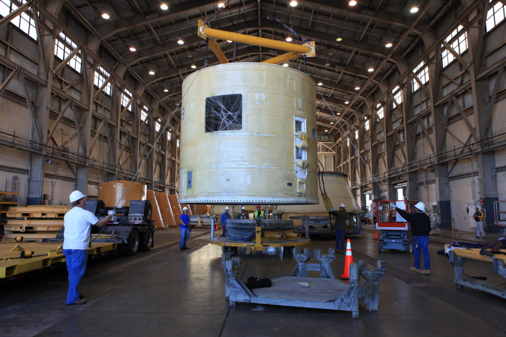 The left-hand forward skirt for the Space Launch System solid rocket boosters arrives at Hangar AF.