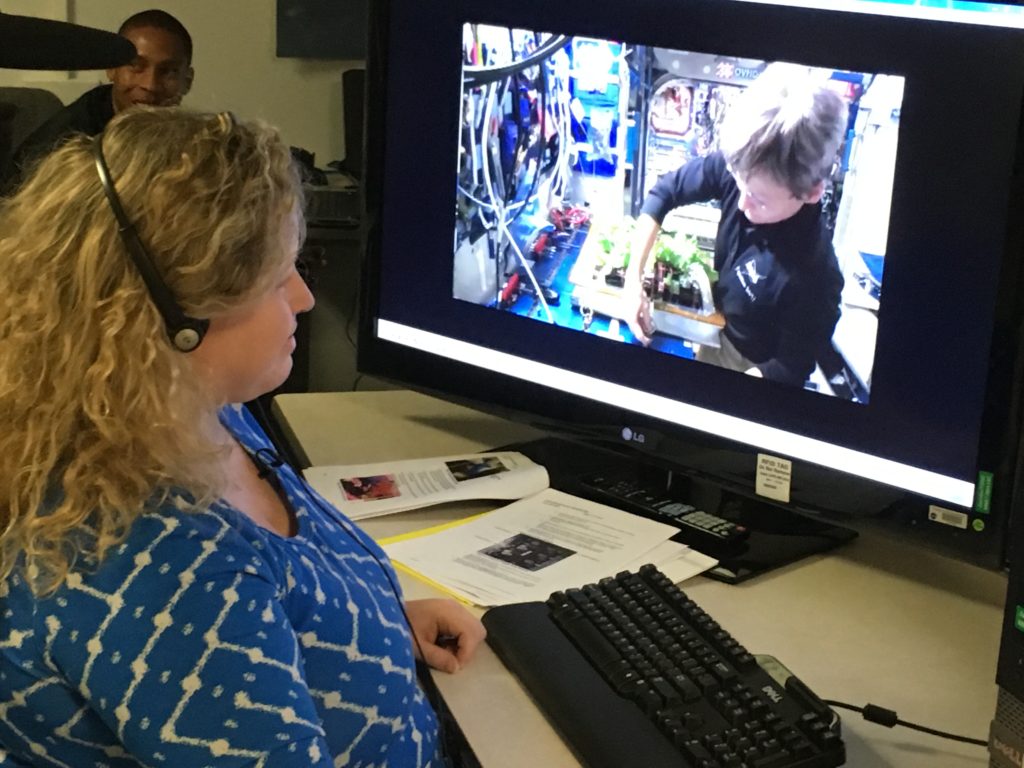 At Kennedy Space Center in Florida, Veggie Project Manager Nicole Dufour instructs astronaut Peggy Whitson during the first harvest of Chinese cabbage aboard the International Space Station last month. Today begins the grow out of the second Chinese cabbage crop aboard the orbiting laboratory. 