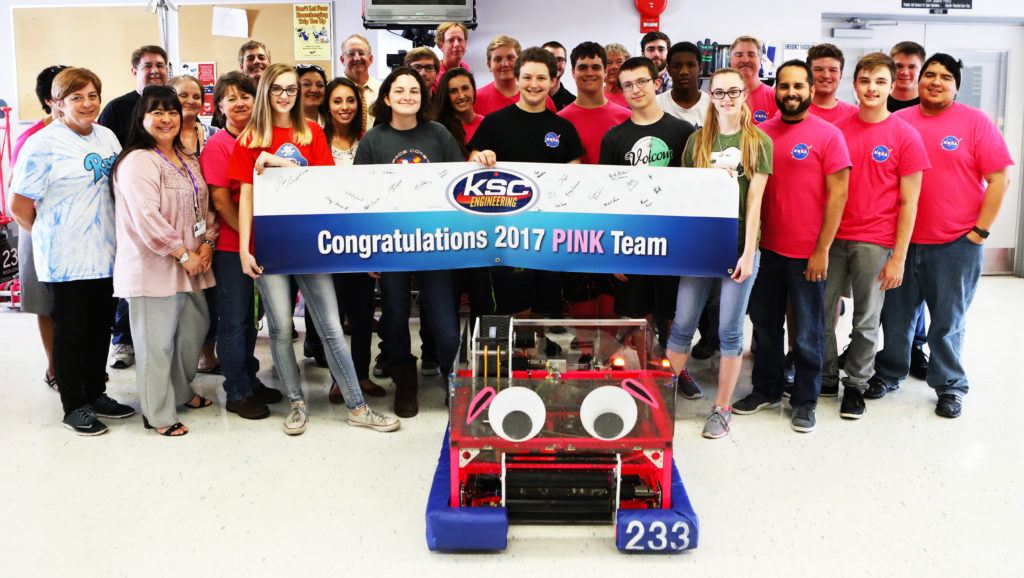 The robotics group known as the "Pink Team." 