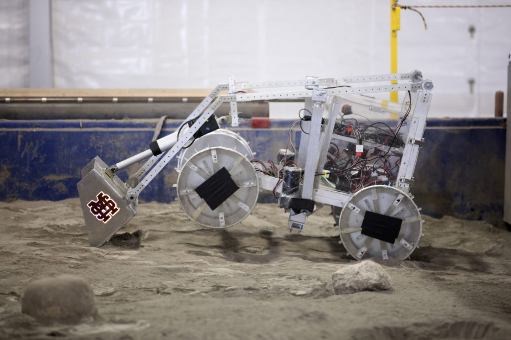 The robotic miner from Mississippi State University digs in the mining arena during NASA's 8th Annual Robotic Mining Competition at the Kennedy Space Center Visitor Complex in Florida. 