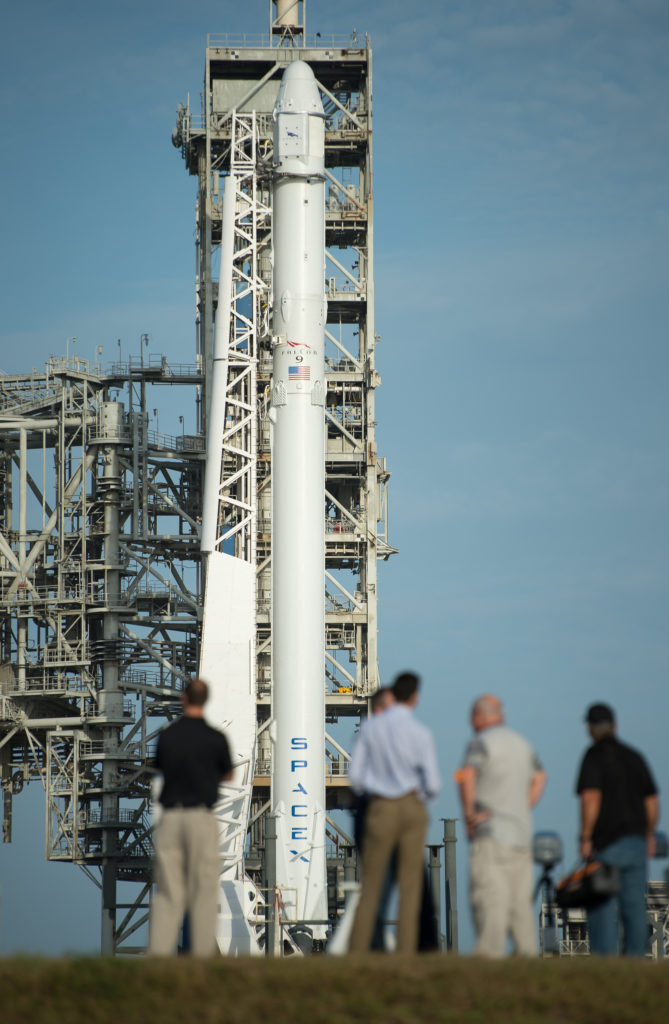 The SpaceX Falcon 9 rocket, with the Dragon spacecraft onboard, is seen shortly after being raised vertical this morning at Launch Complex 39A at NASA’s Kennedy Space Center in Florida. 