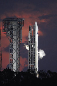 Just before sunrise at Space Launch Complex 41 at Cape Canaveral Air Force Station in Florida, a United Launch Alliance Atlas V rocket vents liquid oxygen propellant vapors during fueling for the lift off of NASA's Tracking and Data Relay Satellite, TDRS-M. 