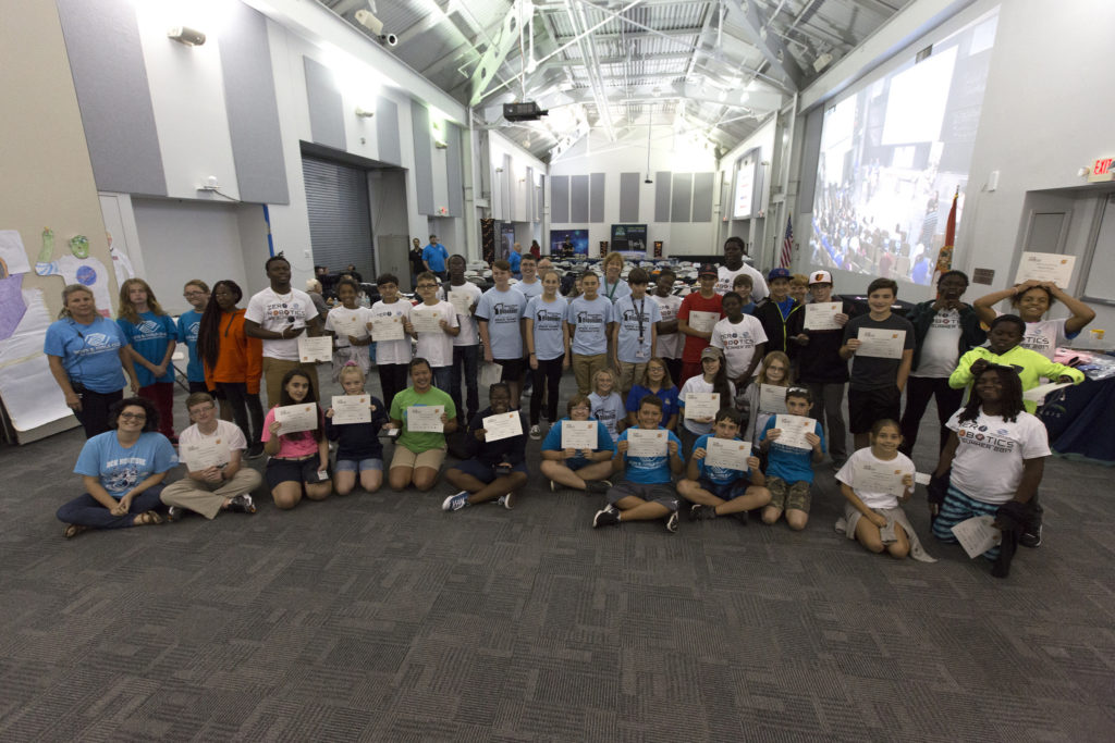 Students and their sponsors gather for a commemorative photo in the Center for Space Education at NASA’s Kennedy Space Center in Florida after participating in the finals of the Zero Robotics Middle School Summer Program national championship.