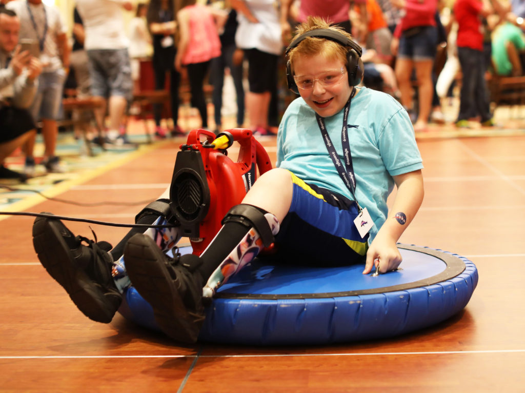 Dreamflight Participant on a hoverboard at NASA Night