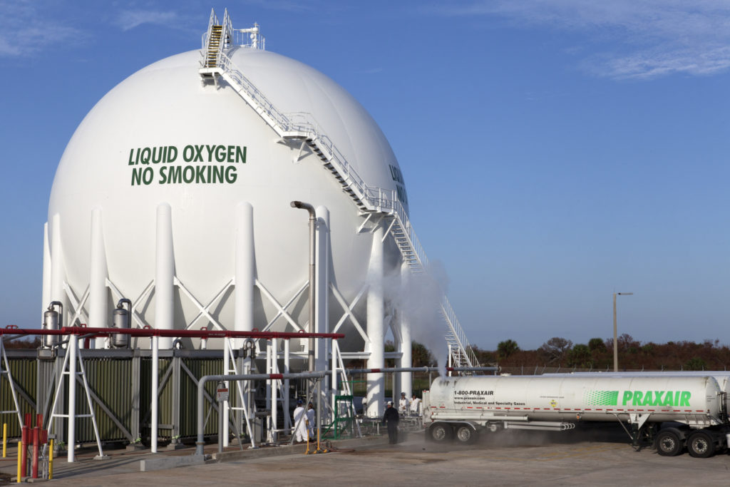 A Praxair truck offloads liquid oxygen into a giant storage sphere at Launch Pad 39B at Kennedy Space Center in Florida.