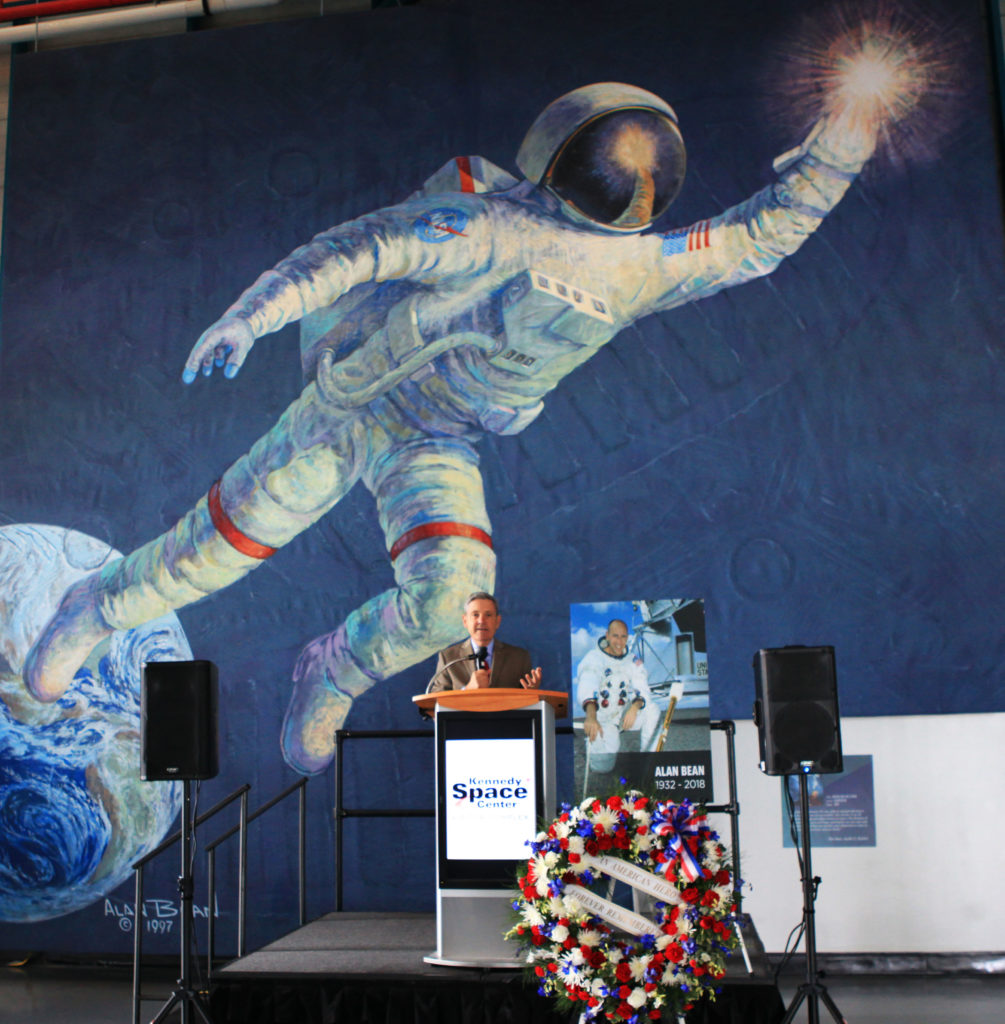 A large mural of a painting by Alan Bean