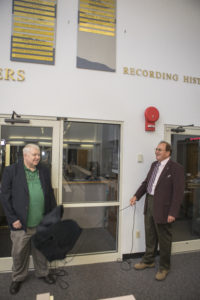 Craig Covault, left, and George Diller unveil their names on the “Chroniclers wall” during a gathering of the honorees’ friends, family, media, and current and former NASA officials at Kennedy Space Center’s NASA News Center in Florida on Friday, May 4.