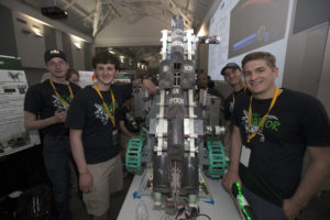 Team Raptor members from the University of North Dakota College of Engineering and Mines check their robot, named "Marsbot," in the RoboPit on May 23, 2017, at NASA's 8th Annual Robotic Mining Competition at the Kennedy Space Center Visitor Complex in Florida.