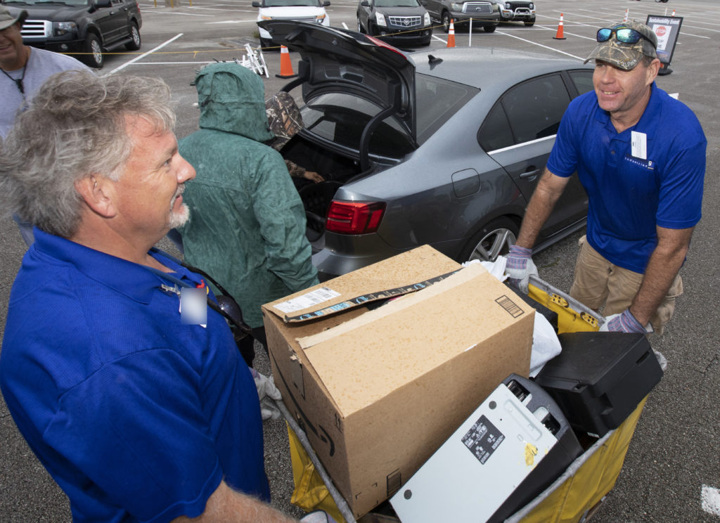 In the parking lot of the Data Center at NASA's Kennedy Space Center on Nov. 15, 2018, employees turn in used household material for recycling as part of America Recycles Day. The annual event is a nationally recognized initiative dedicated to promoting recycling in the United States. This year, KSC is partnered with Goodwill Industries and several other local organizations to receive donation material from employees such as gently used household items, personal electronic waste, greeting cards and serviceable eyeglasses. Photo credit: NASA/Kim Shiflett