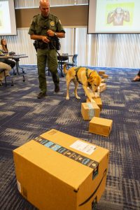 Fish and Wildlife Conservation Commission's (FWC) Port K9 Harry demonstrates how FWC is using specially trained dogs in airports, seaports, and mail facilities to detect illegal and invasive fish and wildlife species shipping into Florida.