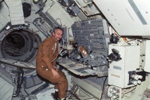 Scientist-Astronaut Owen K. Garriott, science pilot of the Skylab 3 mission, is stationed at the Apollo Telescope Mount (ATM) console in the Multiple Docking Adapter of the Skylab space station.