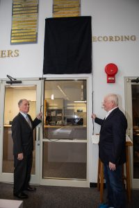 Vic Ratner, left, and Todd Halvorson unveil their names, along with the names of Jim Banke and Peter Cosgrove, now on display on The Chroniclers wall at Kennedy Space Center’s NASA News Center in Florida during a ceremony May 3, 2019. Banke, Halvorson, Ratner and Cosgrove were honored as members of The Chroniclers, which recognizes retirees of the news and communications business who have helped spread news of American space exploration from Kennedy for 10 years or more.