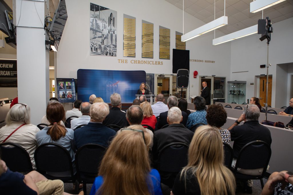 Current and former NASA officials, space journalists, and friends and families gather in Kennedy Space Center’s NASA News Center in Florida during a ceremony May 3, 2019, in which four individuals were added to The Chroniclers roll of honor. The 2019 Chroniclers are journalists Jim Banke and Todd Halvorson, radio broadcaster Vic Ratner and photographer Peter Cosgrove. 