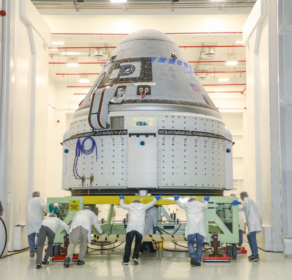 The CST-100 Starliner spacecraft to be flown on Boeing’s Orbital Flight Test (OFT) is viewed Nov. 2, 2019, while undergoing launch preparations inside the Commercial Crew and Cargo Processing Facility at Kennedy Space Center in Florida